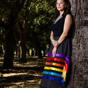 A woman in a colorful skirt