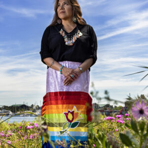 A woman in a colorful skirt