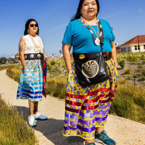 A woman in a colorful skirt