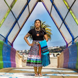 A woman in a colorful skirt