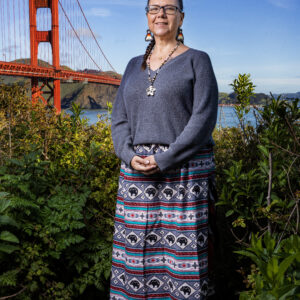 A woman in a colorful skirt
