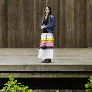 A woman in a colorful skirt