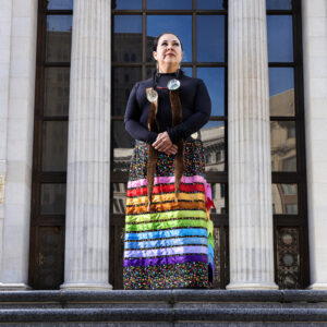 A woman in a colorful skirt