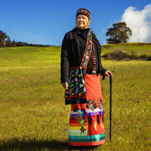 A woman in a colorful skirt