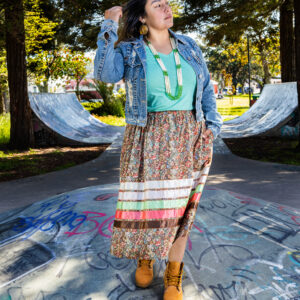 A woman in a colorful skirt